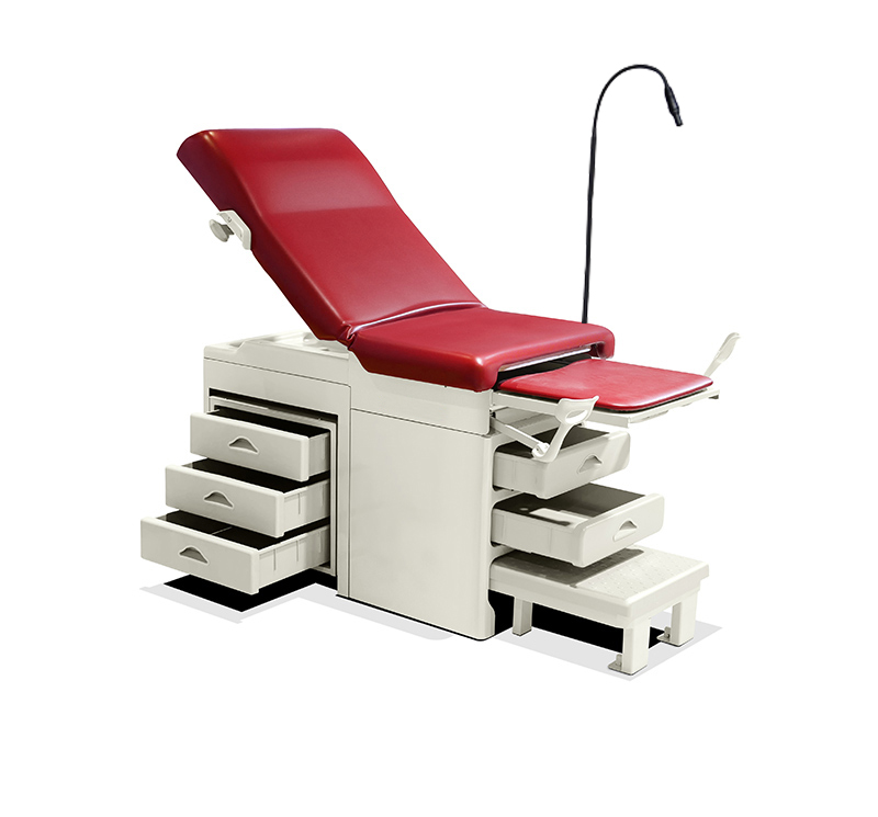 Midmark Ritter similar type manual gynecological table with drawers and lamp